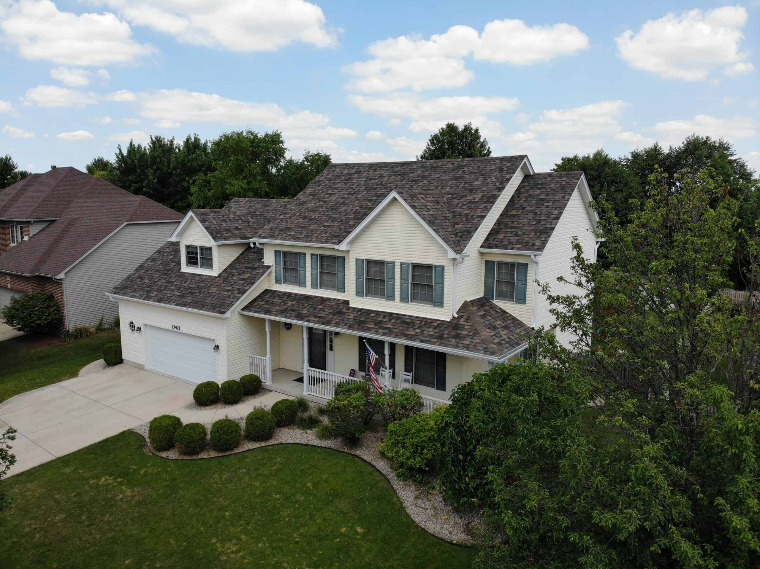 Aerial Shot Of House With Brown Shingles