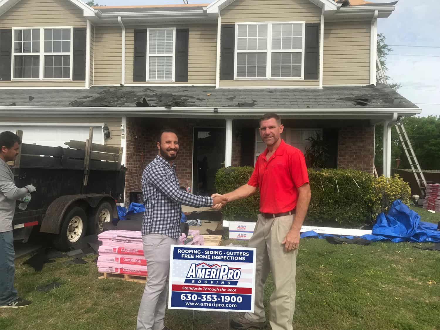 Jim Abely Shaking Hands With a Homeowner
