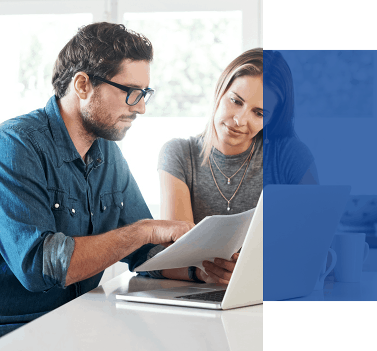 Couple looking at insurance claims for their roof