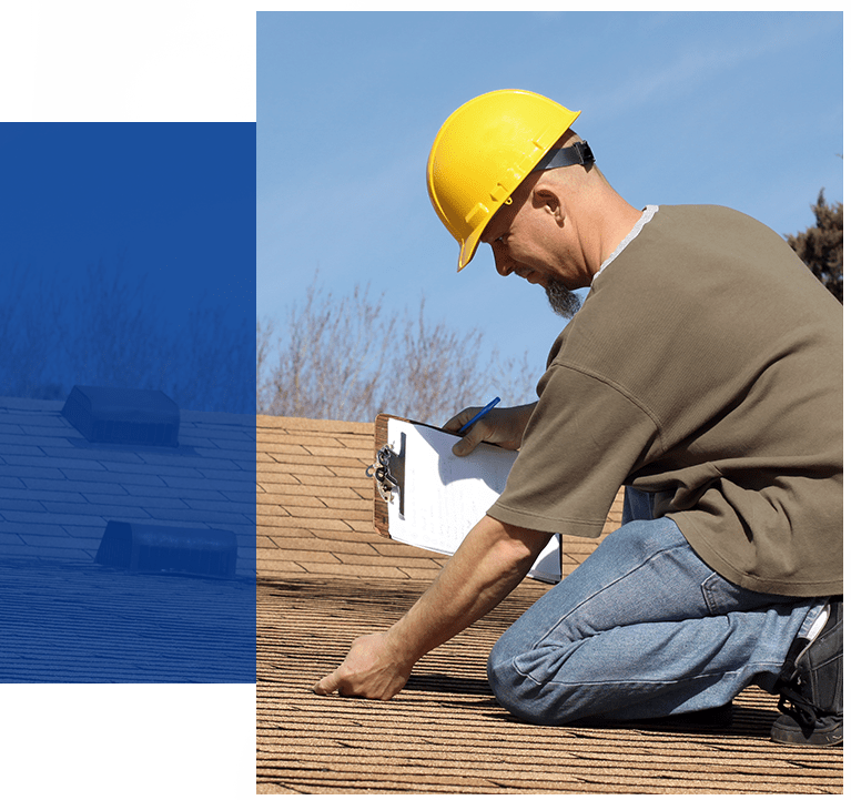 Worker inspecting roof rot