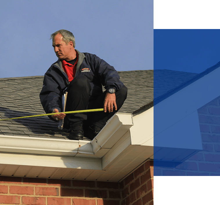 AmeriPro worker performing a roof inspection