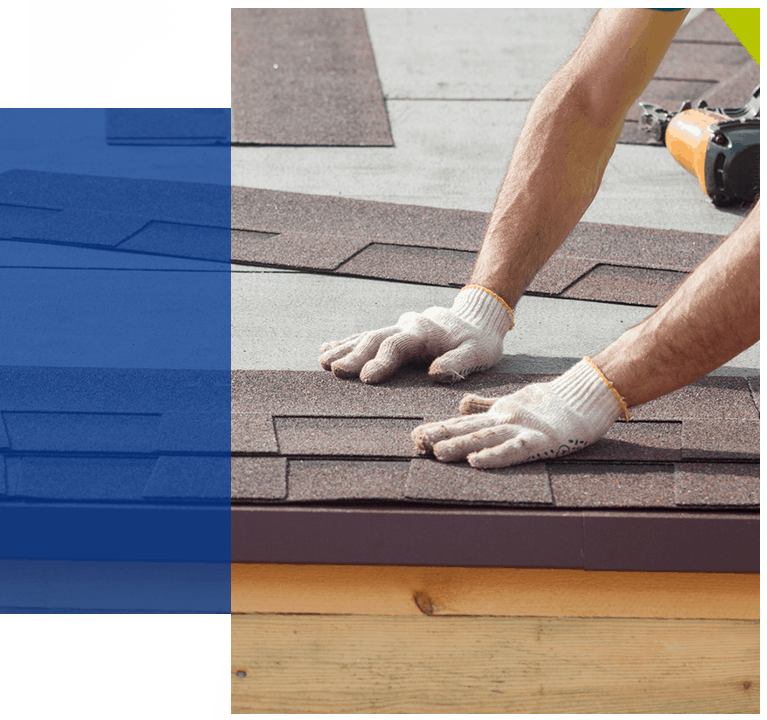 Worker replacing shingles on a roof