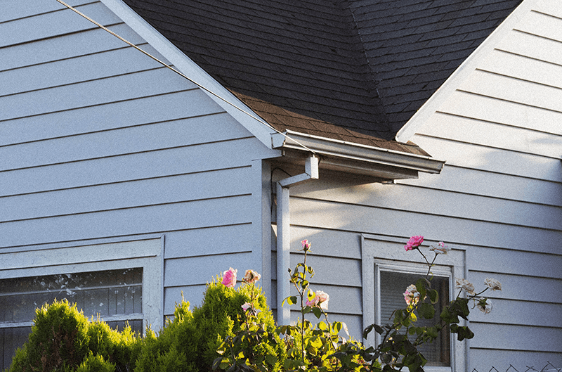 White Gutters On A House