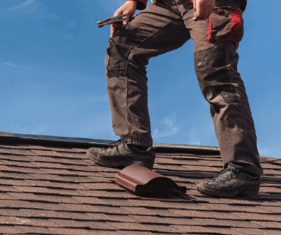 Roofer on a brown roof